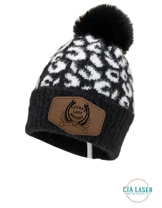 Chic Leopard Print Knit Beanie With Pom Laser Engraved Lucky's Last Resort patch