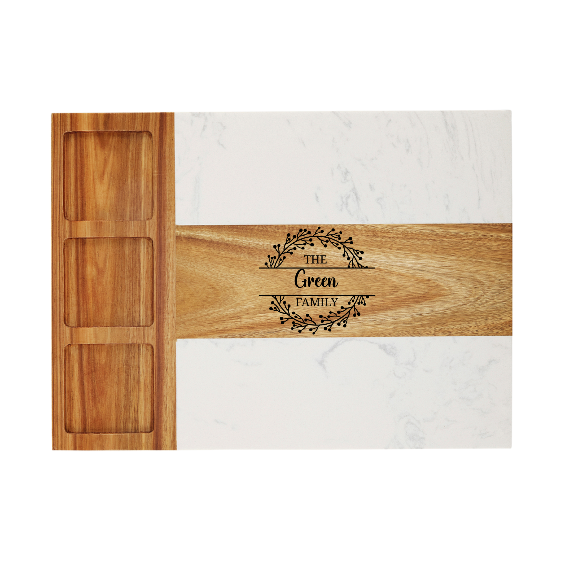 Wooden cutting board with engraved 'The Green Family' design on a marble surface